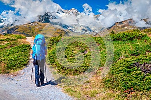 Alpine hiking trail with active backpacker tourist, Zermatt, Switzerland, Europe