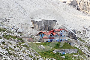 Alpine hut Rifugio Agostini and mountain alps panorama in Brenta Dolomites, Italy