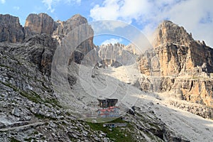 Alpine hut Rifugio Agostini and mountain alps panorama in Brenta Dolomites, Italy