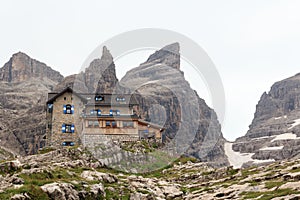 Alpine hut Rifugio Tuckett Mountain Cima Sella panorama in Brenta Dolomites, Italy