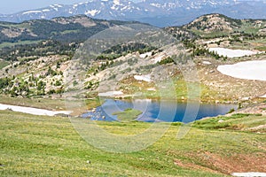 Alpine lake along the Beartooth Highway. Yellowstone Park, Peaks of Beartooth Mountains, Shoshone National Forest, Wyoming, USA.