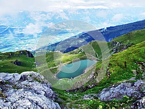 Alpine Lake Baschalvasee under the Pizol peak in the mountain range Glarus Alps