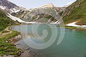 Alpine lake called Nassfeld Speicher in Hohe Tauern National Park. Austria