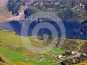 The alpine lake Engstlensee at the upper Gental Valley and in the Uri Alps mountain massif, Innertkirchen - Switzerland