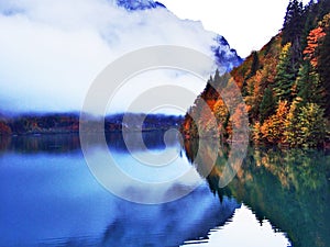 Alpine lake Klontalersee in Klontal valley and mountain range Glarus Alps