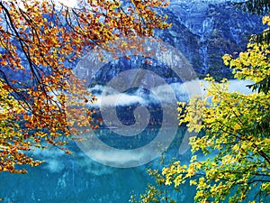 Alpine lake Klontalersee in Klontal valley and mountain range Glarus Alps