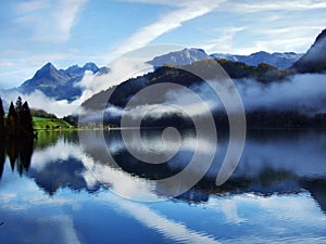 Alpine lake Klontalersee in Klontal valley and mountain range Glarus Alps