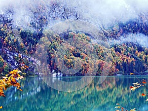 Alpine lake Klontalersee in Klontal valley and mountain range Glarus Alps