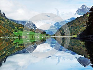 Alpine lake Klontalersee in Klontal valley and mountain range Glarus Alps