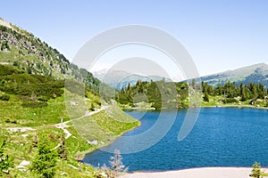 Alpine lake landscape. Rolle pass area, dolomites