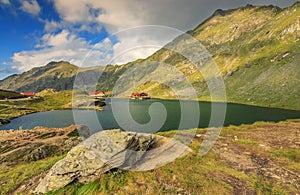 Alpine lake and restaurant on a lake,Balea lake,Fagaras mountains,Carpathians,Romania photo