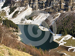 Alpine lake Seealpsee in the Alpstein mountain range and in the Appenzellerland region