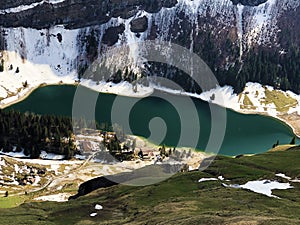 Alpine lake Seealpsee in the Alpstein mountain range and in the Appenzellerland region