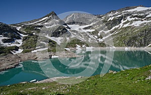 Alpine lake and snowy peaks in summer