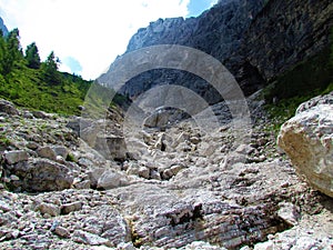 Alpine landscape with large boulders and glacial erratics in Krnica valley in Julian alps, Slovenia