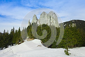 Alpine landscape, mountain chalet and high cliffs photo