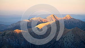 Alpine landscape with mountain ranges, peaks catching last light during sunset, Europe, Slovakia