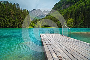 Alpine landscape with mountains and turquoise lake in Slovenia