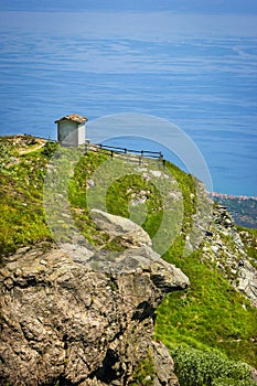 Alpine landscape with small soldiers monument facing the Mediteranean Sea in Beigua National Geopark