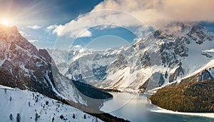 Alpine landscape of snowy mountains and glacier lake. Natural scenery