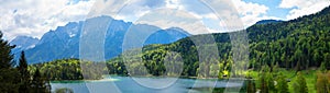 Alpine landscape at springtime, lake Lautersee and green forest, Wetterstein mountains bavaria