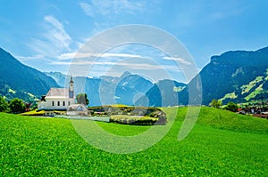 Alpine landscape with typical church Austrian Alps