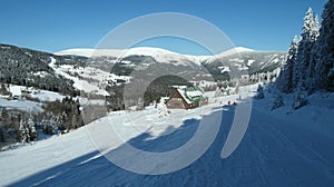 Alpine landscape in winter under freshly snowing snow