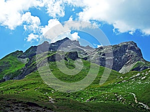 Alpine mountain peak Naafkopf over the Naaftal and Saminatal alpine valleys and in the Liechtenstein Alps mountain massiv - Steg