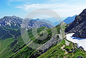 Alpine mountain peaks Spitz, Gamsgrat and Raucher Berg over the Malbuntal alpine valley and in the Liechtenstein Alps