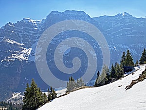 The alpine mountain range GlÃ¤rnisch in the Swiss massif of Glarus alps and over the KlÃ¶ntalersee reservoir lake