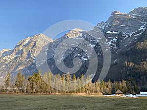 The alpine mountain range GlÃ¤rnisch in the Swiss massif of Glarus alps and over the KlÃ¶ntalersee reservoir lake