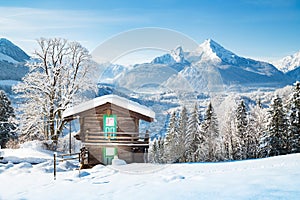 Alpine mountain scenery with cabin in winter