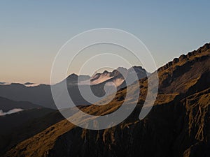 Alpine mountain valley sunset, nature landscape panorama from Brewster Hut West Coast Otago Southern Alps New Zealand