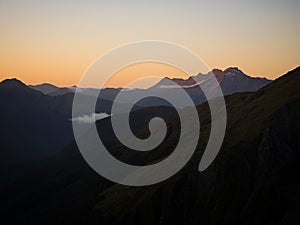 Alpine mountain valley sunset, nature landscape panorama from Brewster Hut West Coast Otago Southern Alps New Zealand