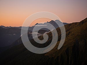 Alpine mountain valley sunset, nature landscape panorama from Brewster Hut West Coast Otago Southern Alps New Zealand