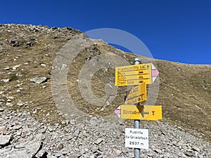 Alpine mountaineering signposts and markings in the mountainous area of the Albula Alps and above the Swiss mountain pass Fluela