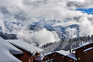 Alpine mountains in the clouds in winter