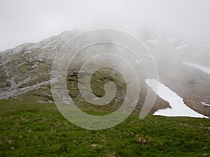 Alpine natural landscale in a foggy weather