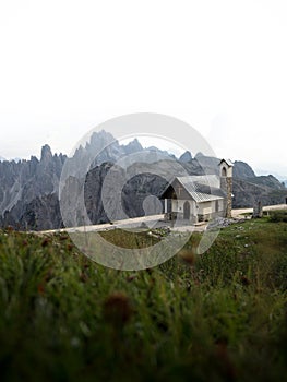 Alpine panorama of Cappella degli Alpini mountain chapel and Cadini di Misurina at Tre Cime Dolomites South Tyrol Italy