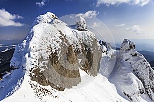 Alpine panorama with snow covered cliffs
