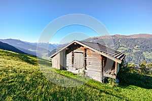 Alpine pasture hike to an old wooden barn with mountain meadow in the austrian alps, Zillertal Austria Europe