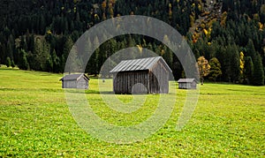 Alpine pastures and barns, panoramic landscape