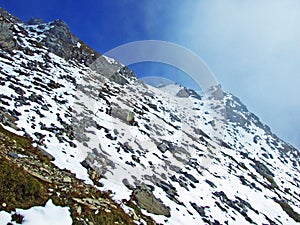 Alpine peak Falknis in the Ratikon border mountain massif or Raetikon Grenzmassiv and over the river Rhine valley Rheintal