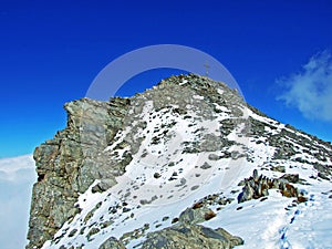 Alpine peak Falknis in the Ratikon border mountain massif or Raetikon Grenzmassiv and over the river Rhine valley Rheintal