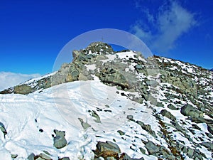 Alpine peak Falknis in the Ratikon border mountain massif or Raetikon Grenzmassiv and over the river Rhine valley Rheintal