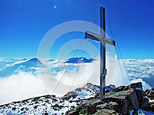 Alpine peak Falknis in the Ratikon border mountain massif or Raetikon Grenzmassiv and over the river Rhine valley Rheintal