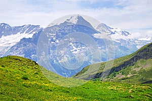 Alpine peaks of Grindelwald and Jungfrau. Landskape background of Bernese highland. Alps, tourism, journey, hiking