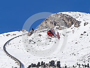 Alpine rescue helicopter in winter
