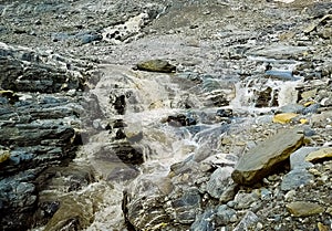 Alpine river at the foot of the Swiss glaciers