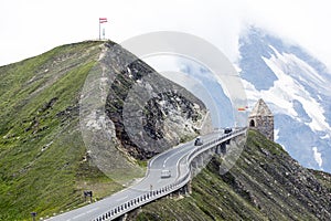 Alpine road, car speeding, Eastern Alps